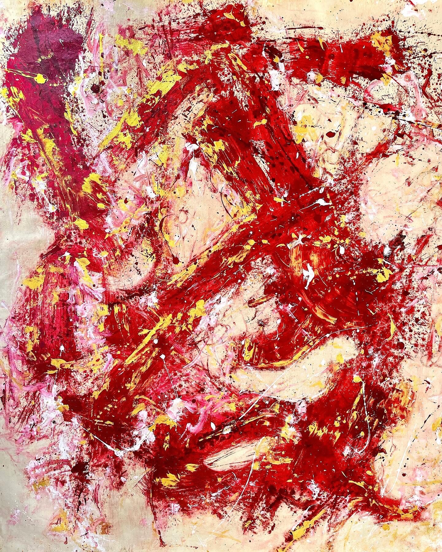 Annie Rios in her studio working on an abstract painting.