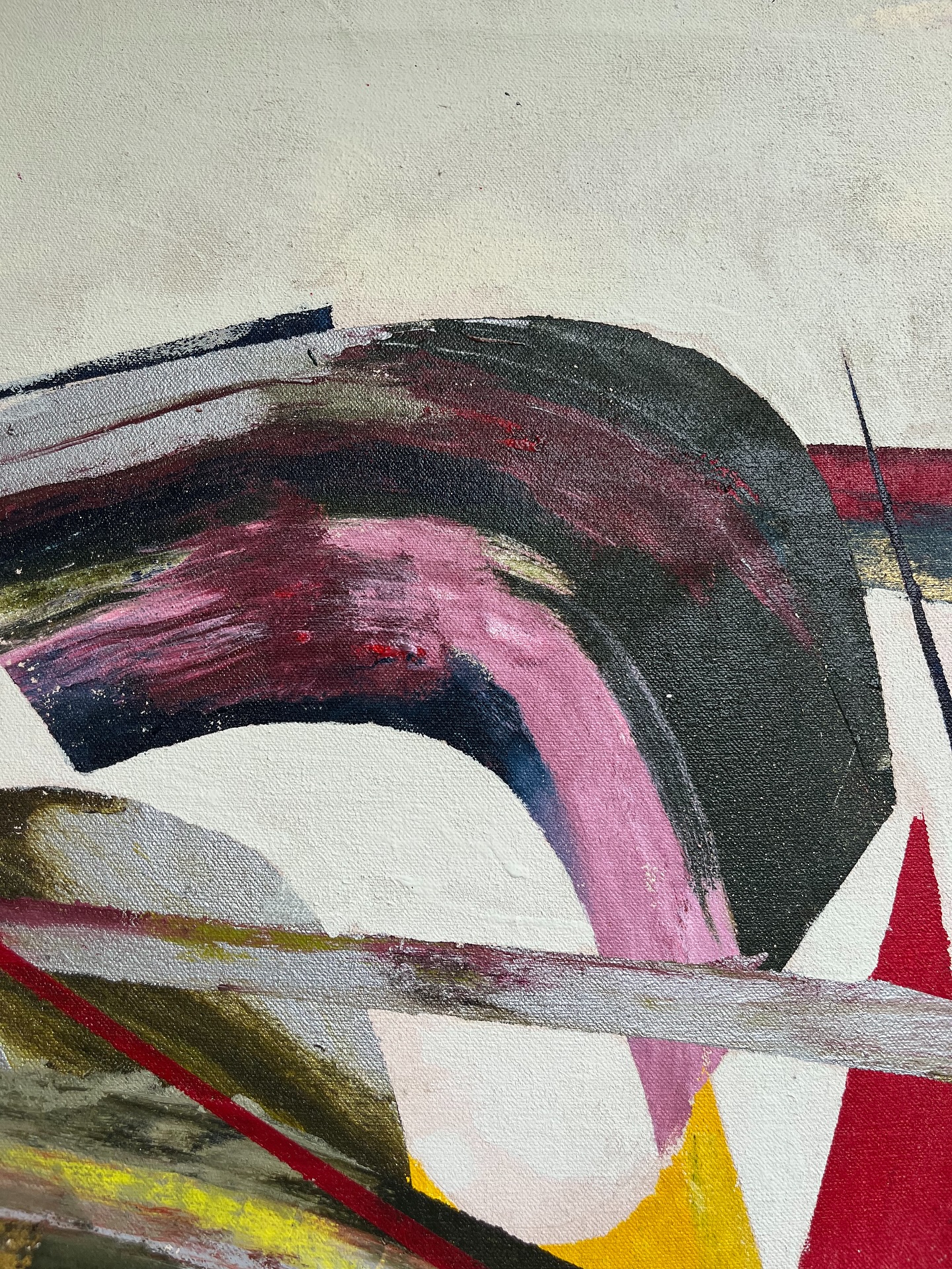 Artwork on grass with paint tubes, showing the raw materials of color.