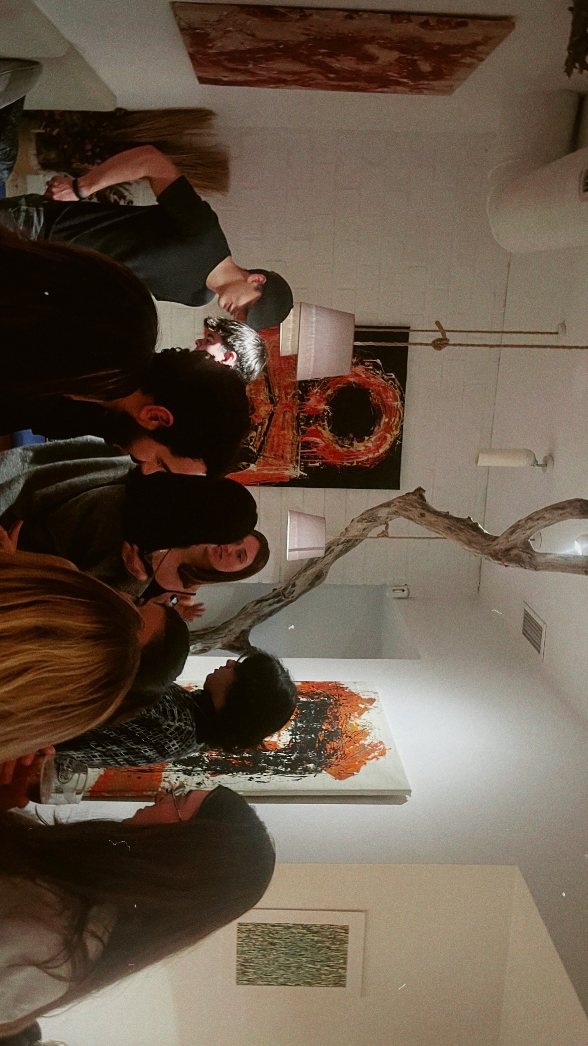 Close-up of a vibrant abstract painting with intersecting lines and colors, representing emotion.