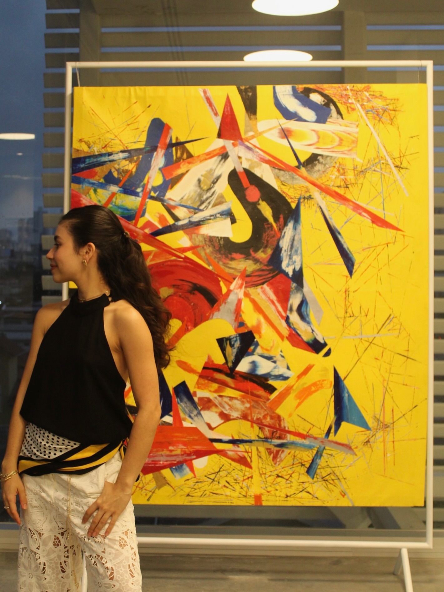 Annie Rios with her artwork 'Composition of a Refraction 1' outside the gallery.